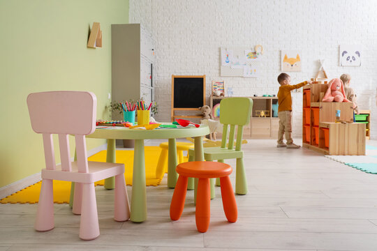 Table with art supplies in kindergarten