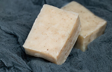 Handmade soap on a fabric background. Personal hygiene.