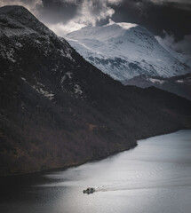 steam boat in landscape with snow and clouds