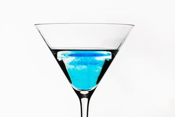 Blue cocktail isolated on white. One blue cocktail martini isolated. 