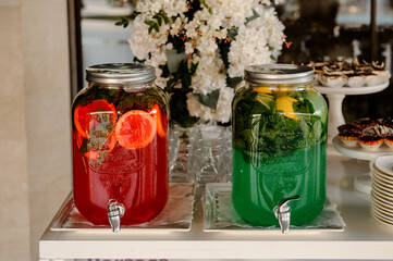  big jar with red and green lemonade  at party