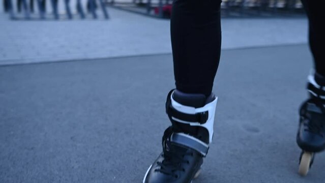Close-up of a woman's legs roller skating. Slalom. 