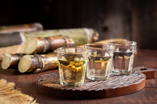 Glasses of cacha&ccedil;a served on the table.
