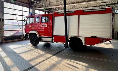fire truck parked at the fire station, ready for action