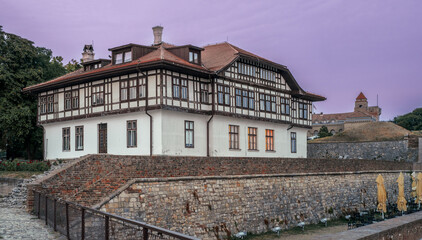 Large house of Balkan tradition inside the Kalemegdan public park at sunset time in the old town of Belgrade, Serbia.