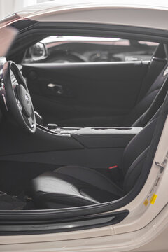 Toyota Supra MK.5 black leather interior view from outside, seats and dashboard - High Resolution Image