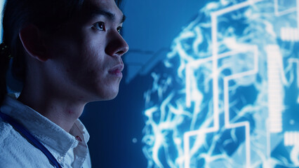 Close up of admin looking at hologram of artificial intelligence cognitive computing human brain...
