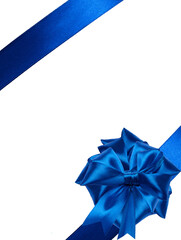 Tied bow made of blue silk ribbon on an isolated background, decor for a gift