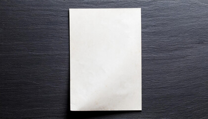 Fototapeta premium a piece of paper on a black wall