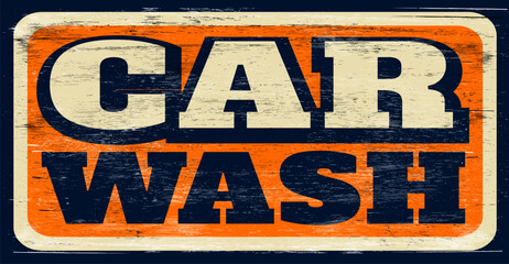 Aged and worn vintage car wash sign on wood