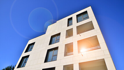 View of a white modern apartment building. Perfect symmetry with blue sky. Geometric architecture detail modern concrete structure building. Abstract concrete architecture.  - 756823539