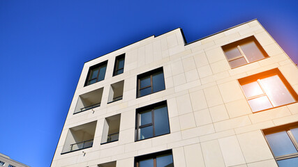 View of a white modern apartment building. Perfect symmetry with blue sky. Geometric architecture detail modern concrete structure building. Abstract concrete architecture.  - 756823577