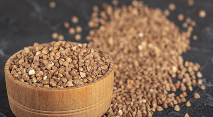 Buckwheat in a wooden bowl is healthy and dietary