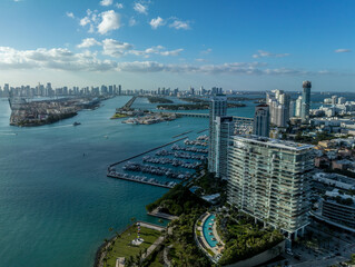 Aerial view of South Pointe Park in Miami with luxury condo towers, sandy beach, Government Cut waterway to carry cruise ship traffic