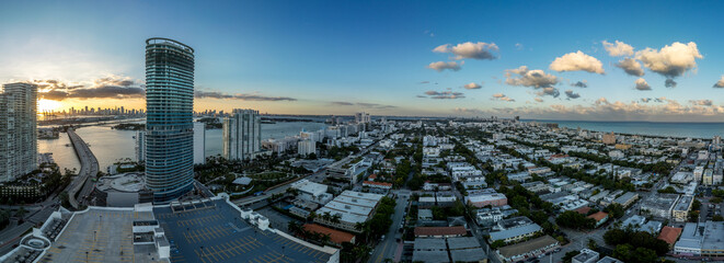 Aerial sunset over Miami South Beach with luxury residential buildings, Art Nuevo houses