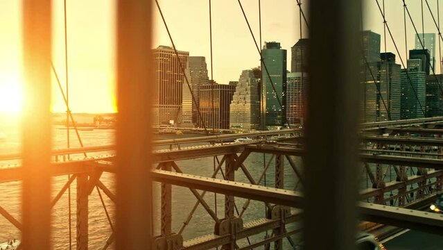 Sunset Video at Brooklyn Bridge Against Illuminated Skyline, in 4K Ultra HD Resolution