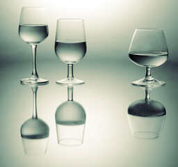 Three wine glasses different shape close up view with reflections