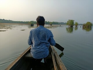 Exploring the majestic backwaters of Kerala India on a man powered boat.