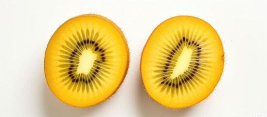 Two kiwi fruits, a type of accessory fruit from the hardy kiwi plant, are shown cut in half on a white background in a closeup macro photography shot - obrazy, fototapety, plakaty