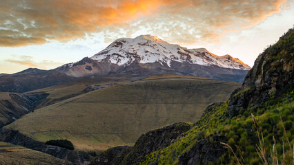 High Andes view of the north face of the Chimborazo volcano at dawn with its summit and the clouds...