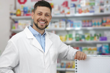 Portrait of professional pharmacist in modern drugstore