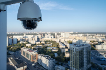 CCTV camera video control at the roof of building watching at cityscape - 756853753