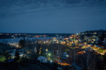 Ples town at Ivanovo region in Russia illuminated in the dusk. Cityscape panoramic night view - 756853795
