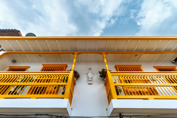 Yellow balconies of a house in Jardin, Colombia