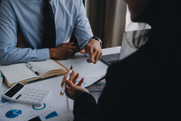 Fototapeta premium Business team working with new startup project plan and discussion information for financial strategy with laptop and digital tablet in a modern business lounge.