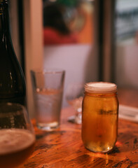 glass of beer on wooden table