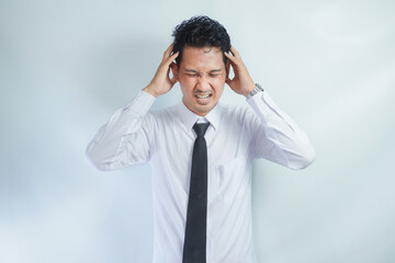 Adult Asian man got painful headache gesture © AriaSandi