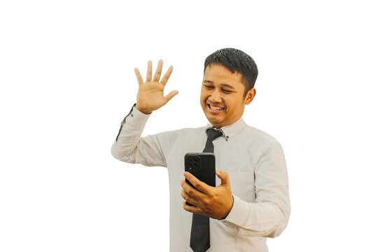 Adult Asian man smiling and hii Five while holding mobile phone