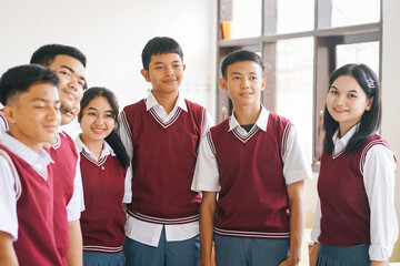 Portrait of Asian High School Students in Uniform Standing at Classroom