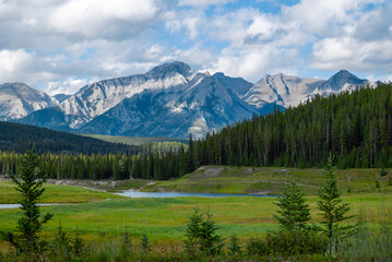 small lake and majestic panorama view of the rockies in Banff, Alberta, Canada