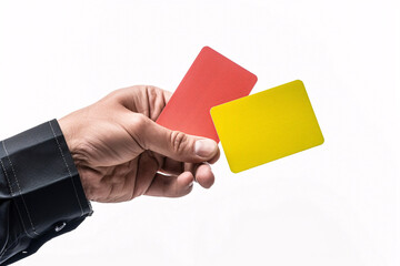 Male football (soccer) referee hand holding yellow and red cards, isolated on white background
