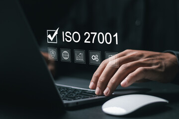 ISO 27001 concept. requirements, certification, management, standards. Businessman using laptop to...
