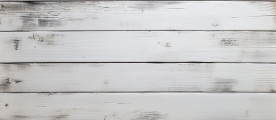 Obraz premium A close up of a rectangular white hardwood plank flooring with a grey blurred background, showcasing a parallel pattern of tints and shades from the wood stain
