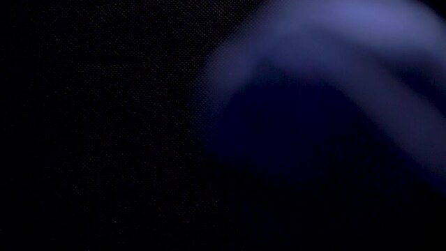 thread fall down in slow motion white green blue black background static