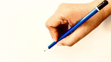 hand with pencil on a white background