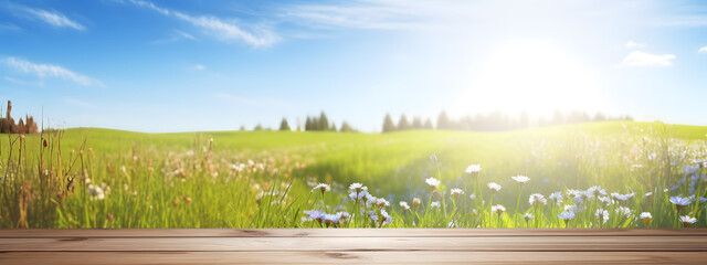 Wooden table top with blurred spring meadow landscape background - obrazy, fototapety, plakaty