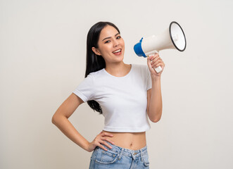 Shout out loud with megaphone. Young beautiful asian woman  announces with a voice about promotions...
