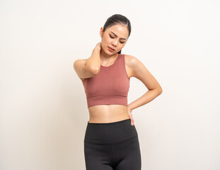 Fototapeta na wymiar Young sporty asian woman has inflamed neck and backache because she is workout exercise too much. Accident suffering while training workout. She massage to soothe and relax on isolated background.