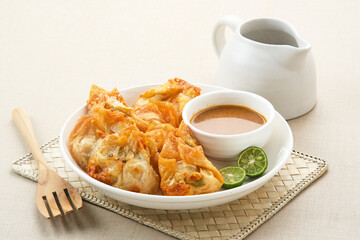 Batagor, made from fish or chicken dumpling, tofu, tapioca flour served with peanut sauce. Indonesian food
