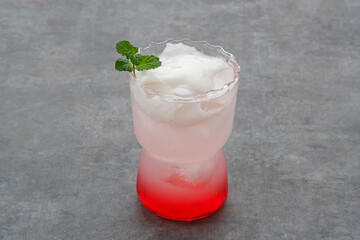 Es Kelapa Muda or young coconut ice with syrup
