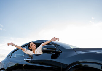 Young beautiful asian business women getting new car. Happy smiling female driving vehicle on the...