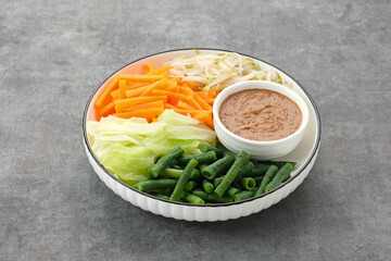 Pecel Sayur, Indonesian traditional salad, mix steamed vegetable with peanut sauce
