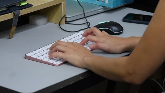 Typing on a Keyboard at a Desk