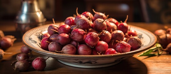 A bowl of radishes, a type of plant and natural food, is displayed on a wooden table. Radishes are a common ingredient in recipes and dishes, known for their crisp texture and peppery flavor