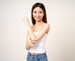 Beautiful smiling happy young asian woman with beauty skin care treatment lotion on the body. Charming female lady standing pose applying body cream Facial treatment beauty and spa