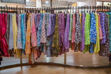 Various types of batik blouse for sale in the retail shop.